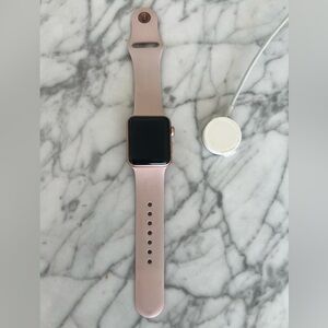 Apple Watch Series 3, 38 MM with the bracelet and charger.